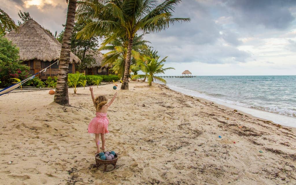 Travel with kids: Playing beach bocce in Belize (4 years old)