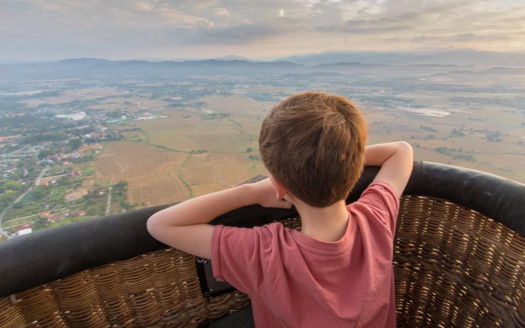 Travel with kids: On New Years Eve in a hot air balloon over Chiang Mai, Thailand. The stopover destination (on the way to Palawan) and balloon ride were my son's ideas.