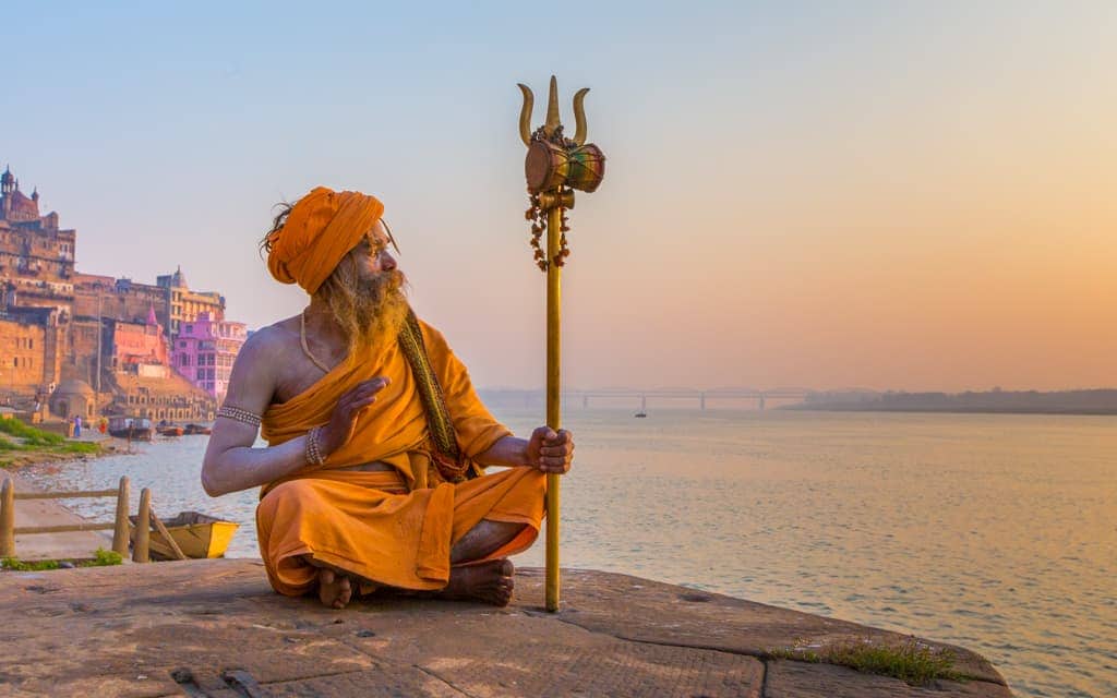 Travel inspiration: A Sadhu (holy man) at sunrise in Varanasi, India