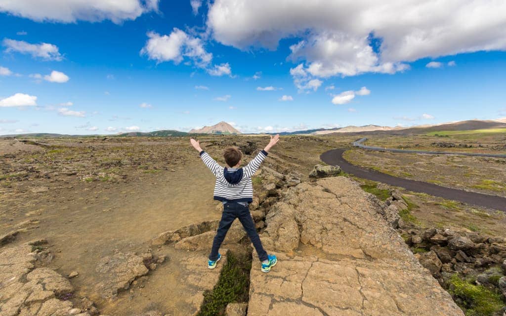 Iceland with kids -At the spot in Iceland where North America and Europe collide. Europe is on the right.
