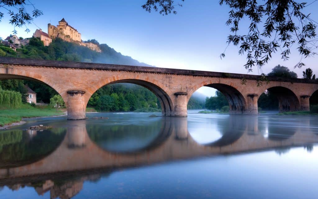 Sunrise at Chateau Castlenaud and the river Dordogne France
