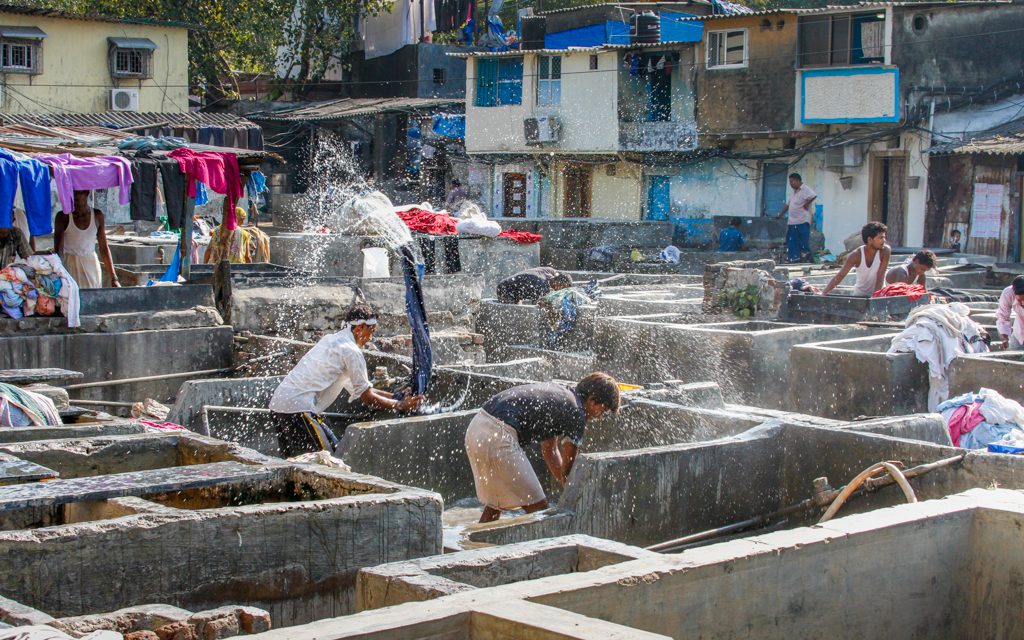 India: Dhobis washing clothes and sheets in a Mumbai ghat