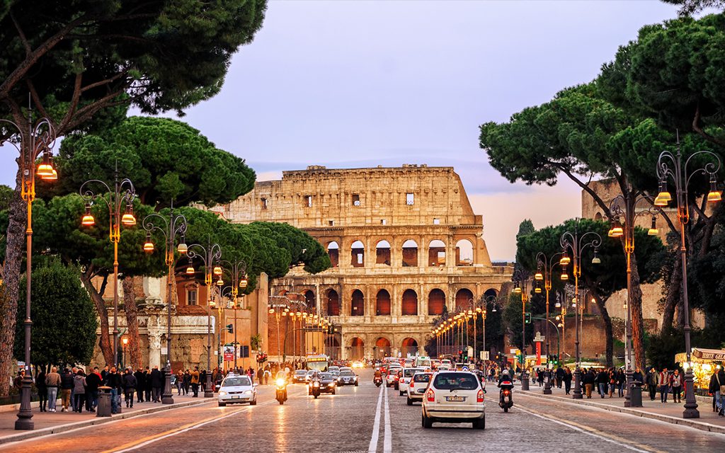 street leading to colosseum in rome