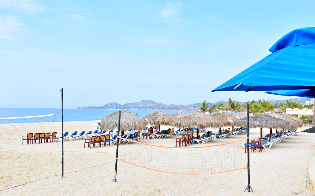 Palapas with lounge chairs at beach