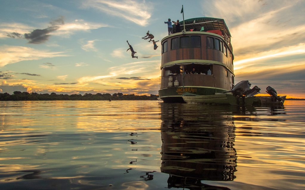 Where to travel in 2019 - Jumping from our boat into the Rio Negro