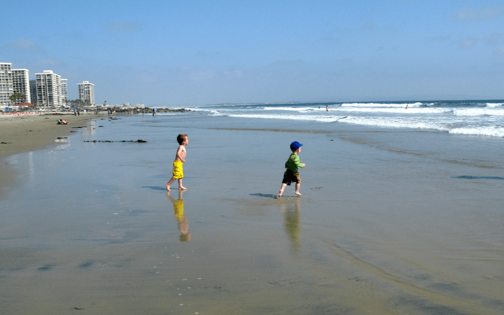 Boys Running on Coronado Beach San Diego Road Trip-Kirsten Maxwell Travelocity