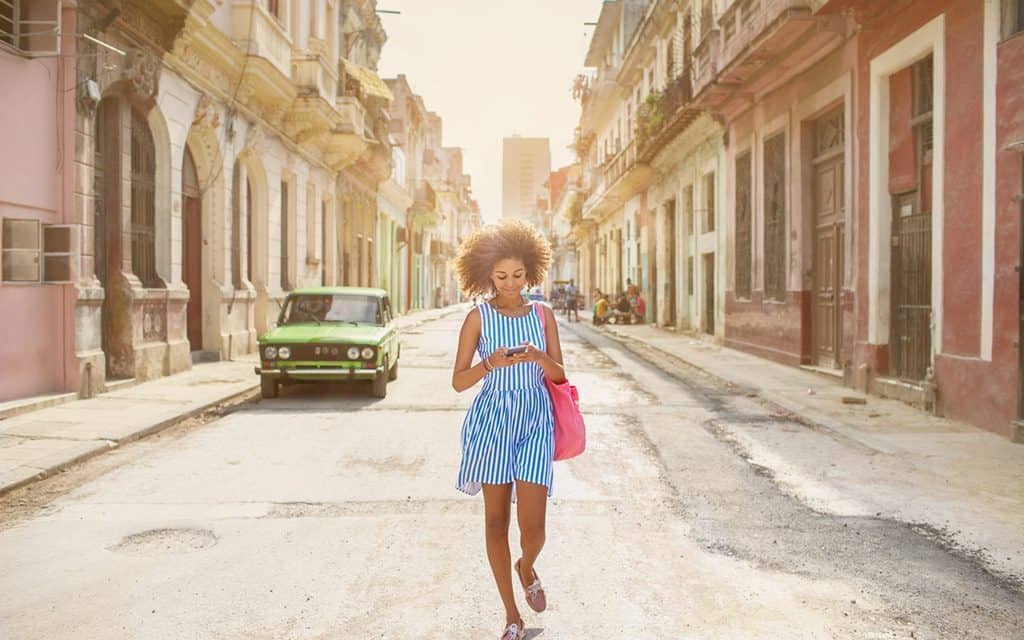 solo travel woman walking down street