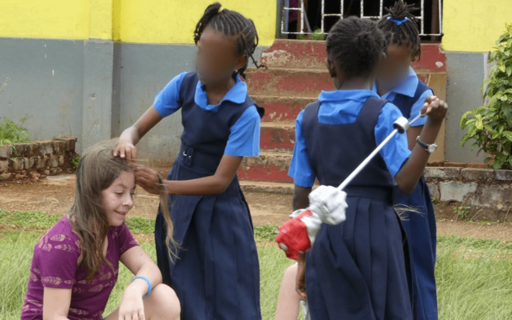 Eden's new friend braiding her hair