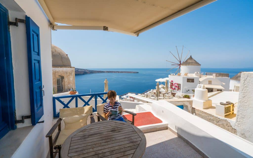 Family Travel Inspiration - Reading in Santorini, Greece