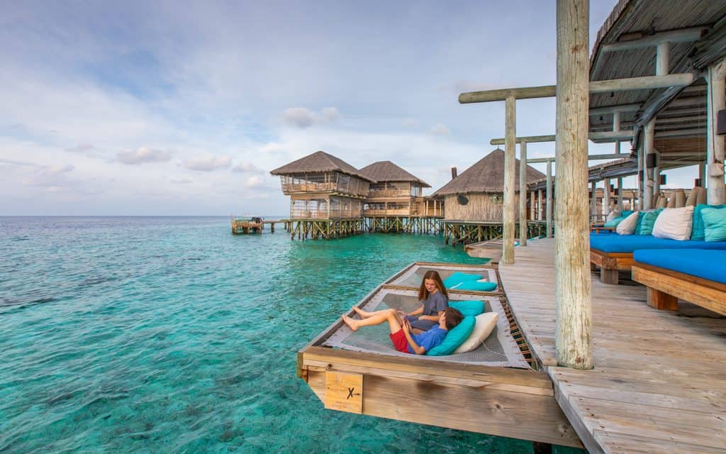 Family Travel Inspiration - Waiting for sunset in an overwater hammock in the Maldives