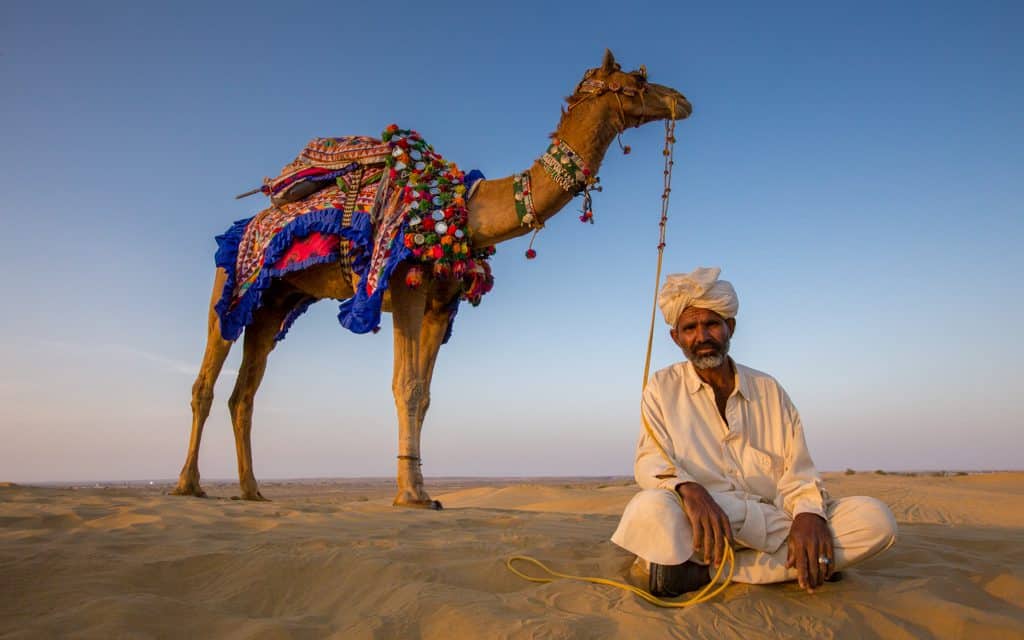 Best adventure destinations - A short stop during a camel ride through Rajasthan