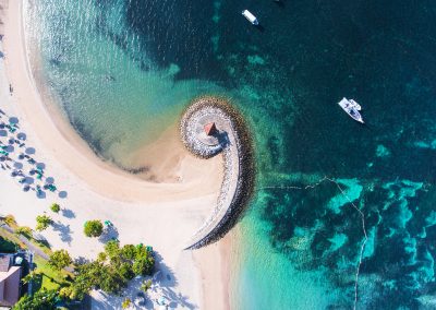 Bali coast with a figurative breakwater aerial view
